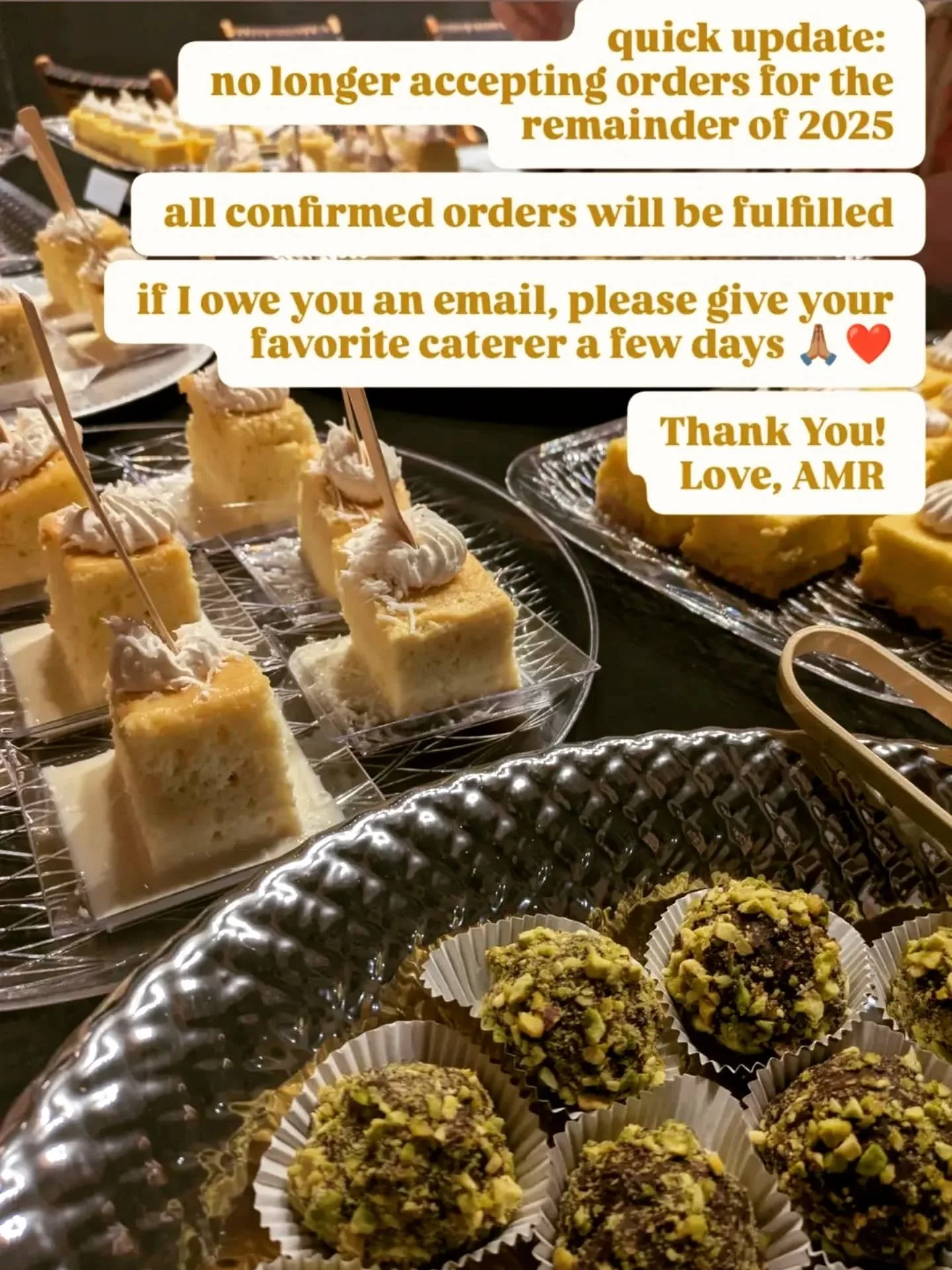 A tall, abundant savory grazing spread by AMR Catering brimming with antipasti, cheeses and breads.